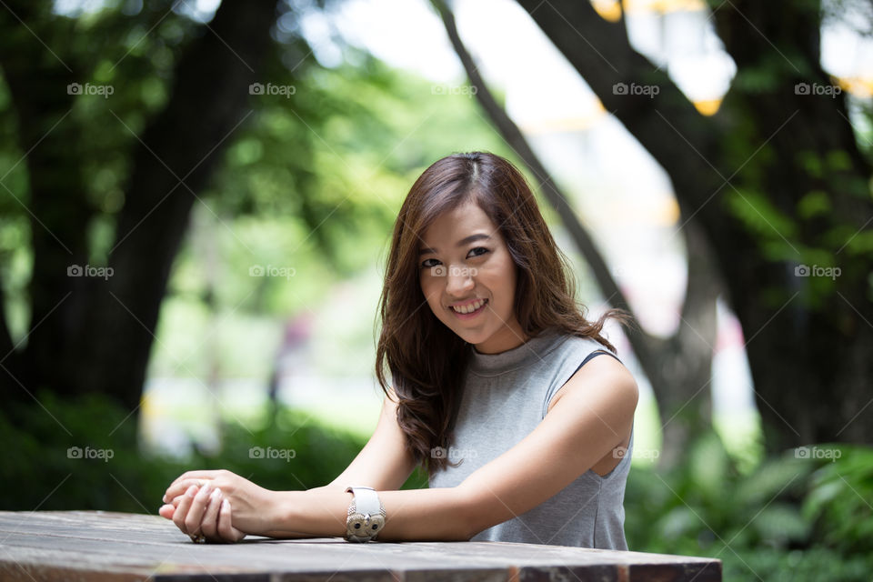 Asian girl sitting on the chair