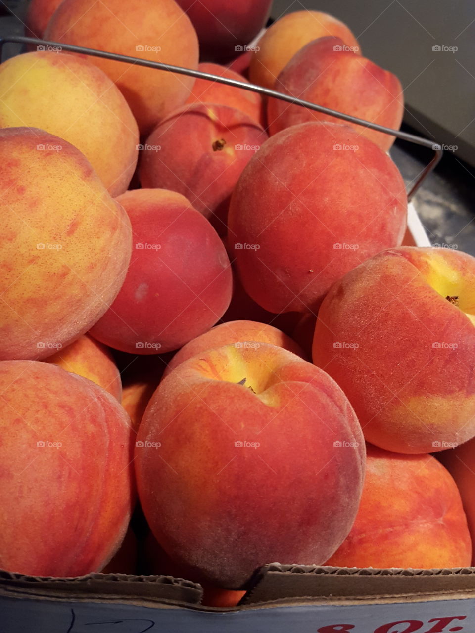 Ripe Peaches in Market Basket