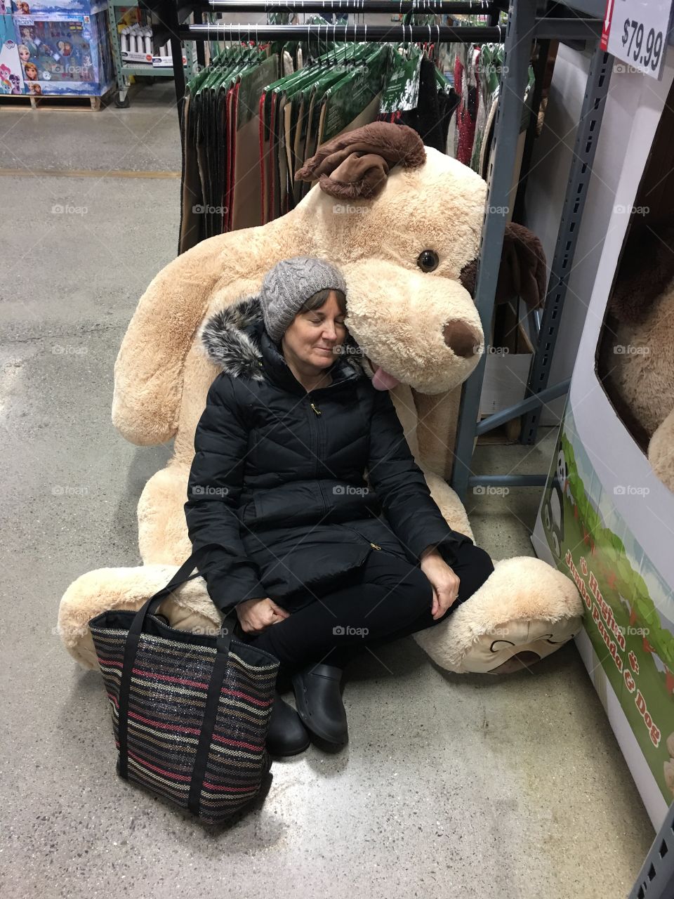 Woman with a giant stuffed animal