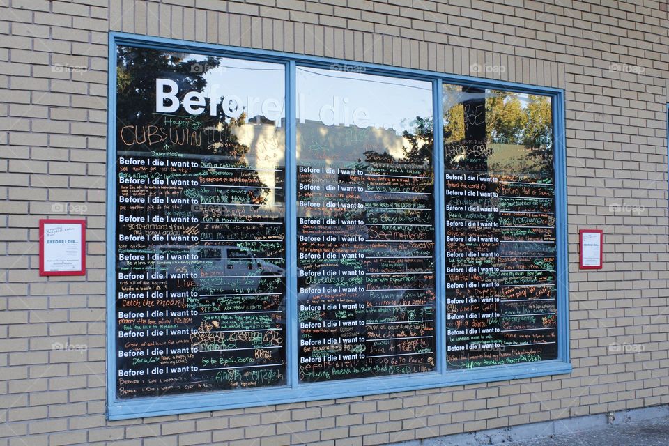Rectangle blue shaped windows on a store front In a downtown city