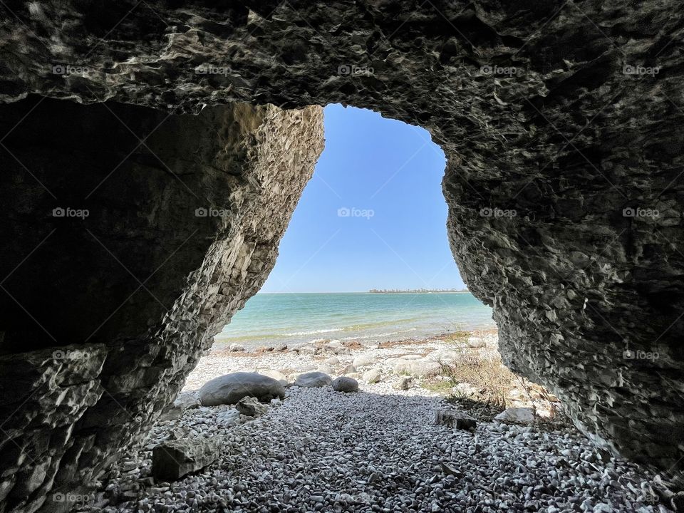 Inside a cave looking out