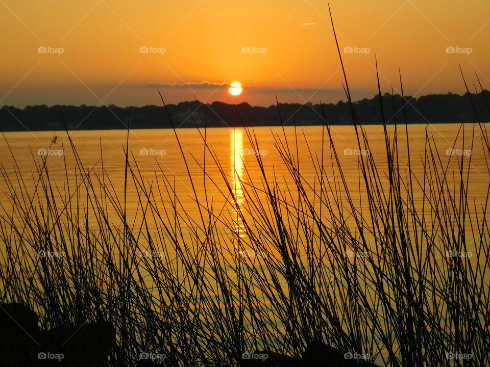 Sunset over calm lake