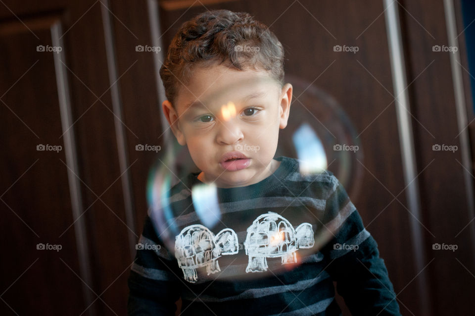 Boy looking at bubble