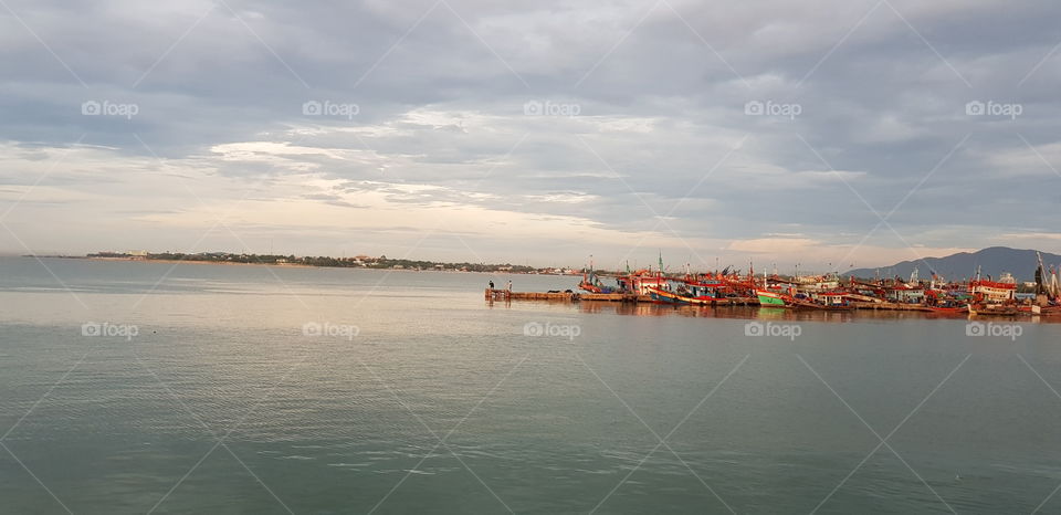 Fishing boats moored at harbor