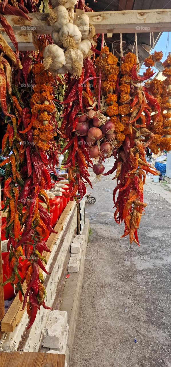 Garlic, onions, chilis, peppers and other colourful spices on a market in Tbilisi, Georgia.