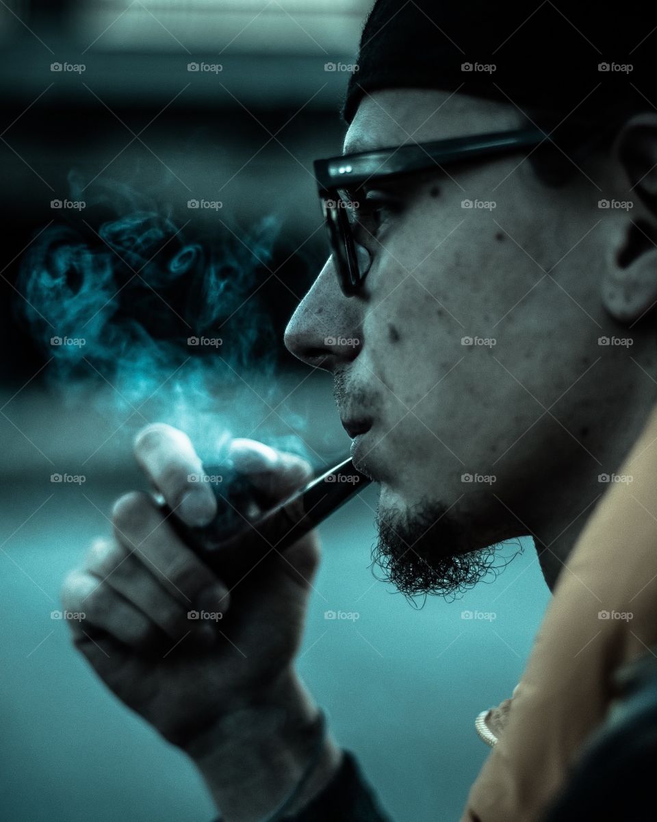 Guy in the glasses smoking a pipe