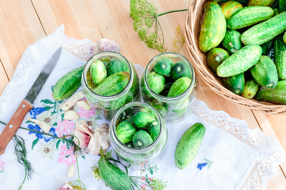 Pickling cucumbers. Pickling cucumbers with home garden vegetables and herbs