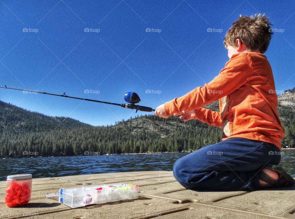 Boy Fishing In Summertime 