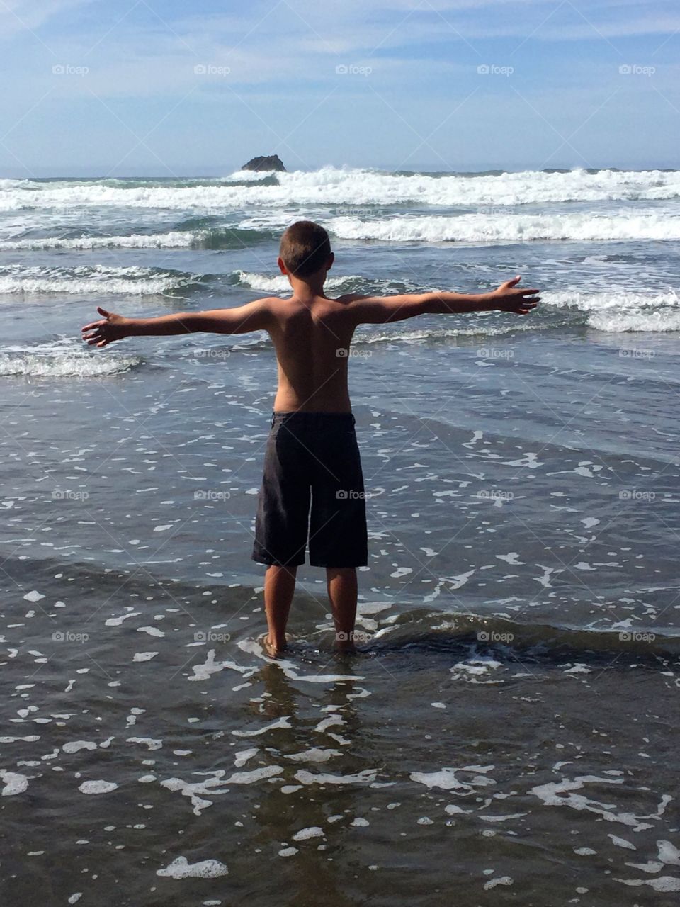 Boy On Beach. Boy excited to be at the beach