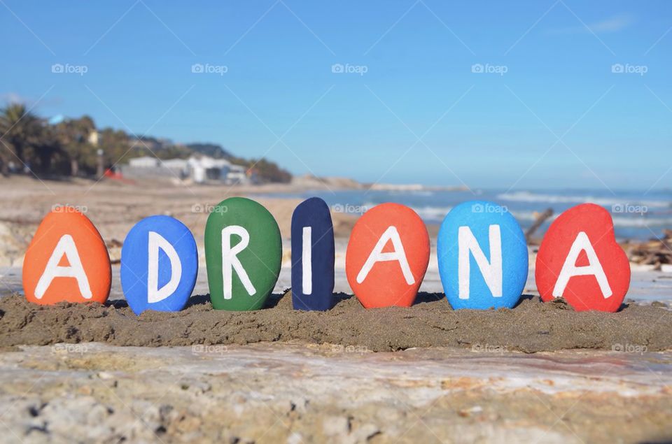 Adriana, female name on colourful stones