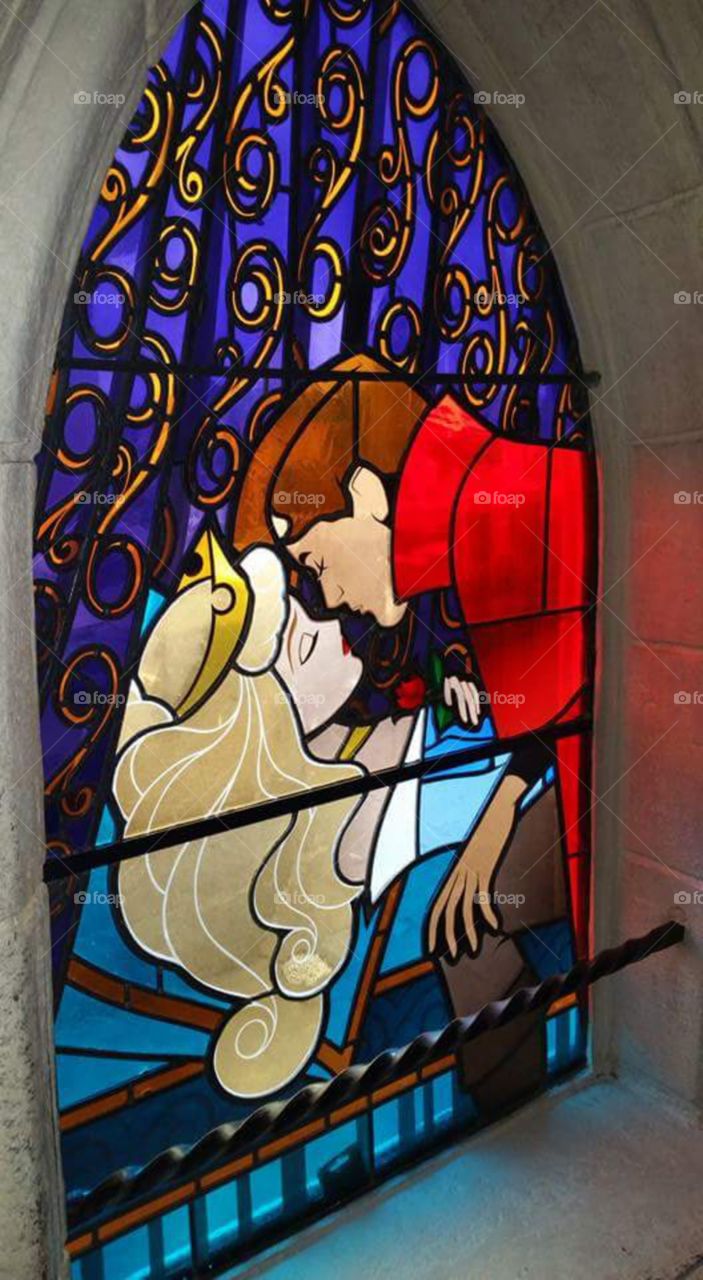 Disney land Paris / Euro Disneys 

true loves kiss
one of Sleeping beauty castles 
stain glass window


(series available  )

Sleeping Beauty Castle is the fairy tale structure castle at the center of Disneyland Park, Hong Kong Disneyland and Disneyland Paris. It is based on the late-19th century Neuschwanstein Castle in Bavaria, Germany,with some French inspirations (especially Notre Dame de Paris and the Hospices de Beaune).