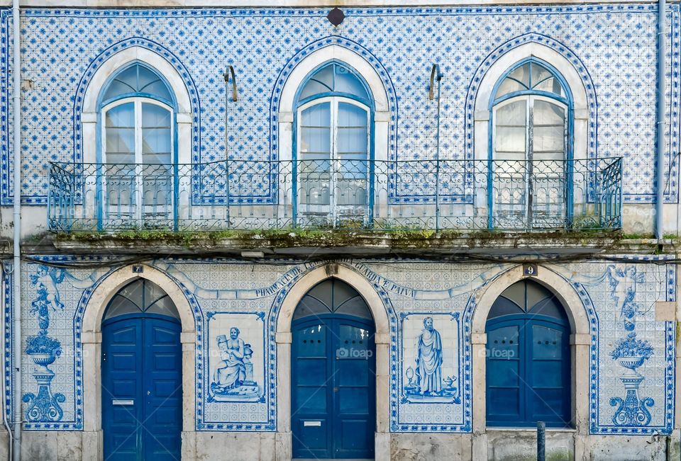 An old building in Portugal decorated in vintage blue tiles