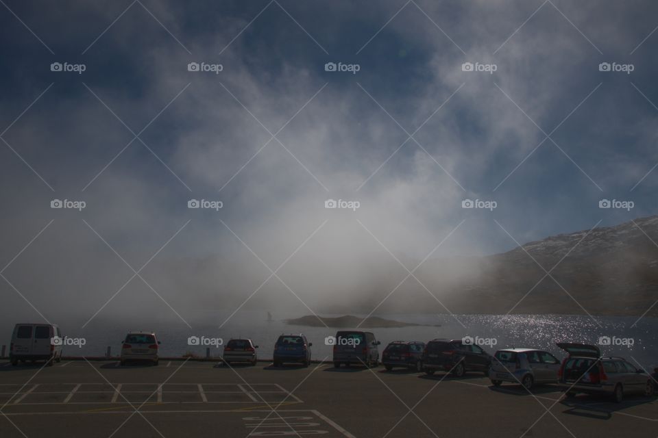Parking By Lake On Swiss Alps