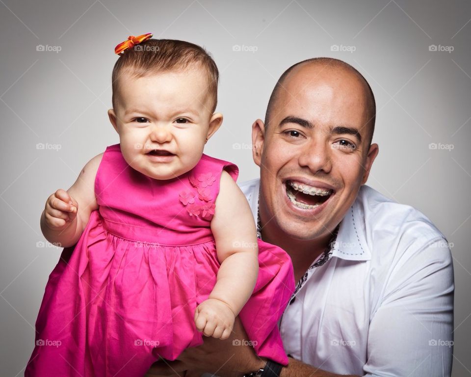 Father with daughter smiling
