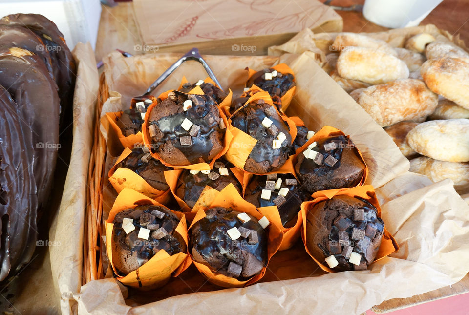 Black and white chocolate muffins in orange wrapping paper