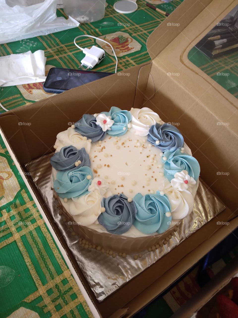 Getting a white tart cake with beautiful blue flowers