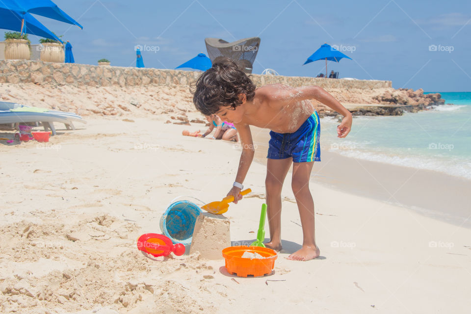 Kid playing by the beach