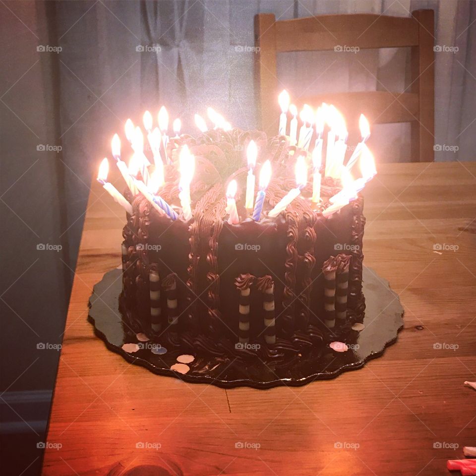Birthday cake, many candles, decorated by an 8 year old