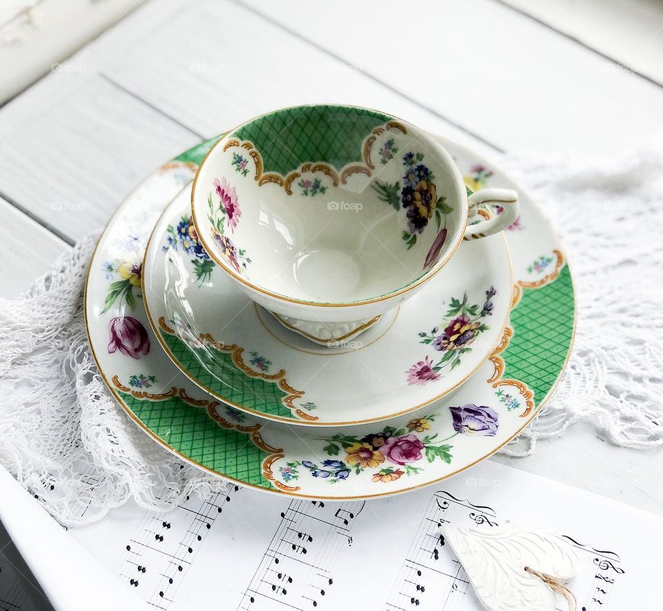 Vintage porcelain tea set with geometrical green ornament