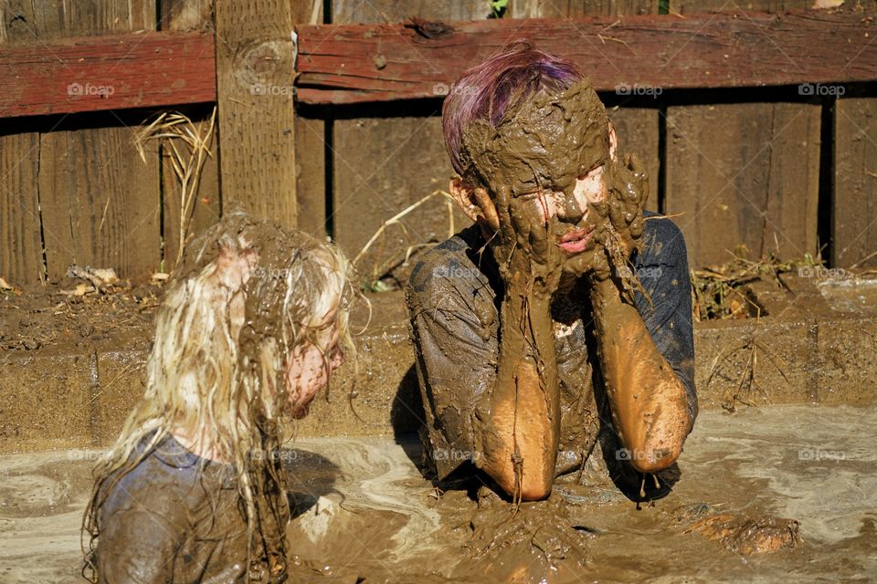 Boys Playing In Mud