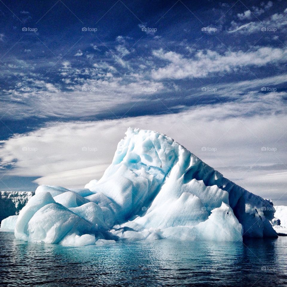 An iceberg floating along the coast of the Antarctic Peninsula.