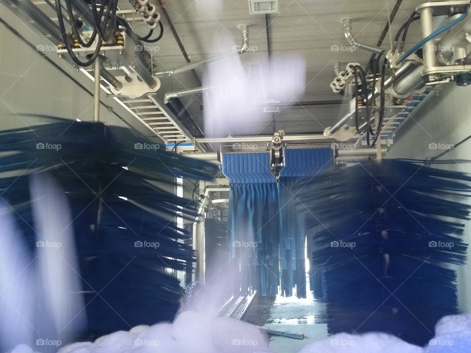 brushes and rollers in drive through  car wash
