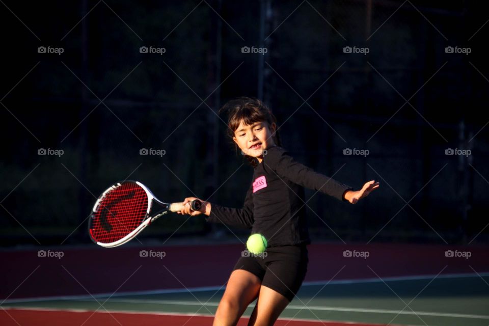 Girl is playing tennis