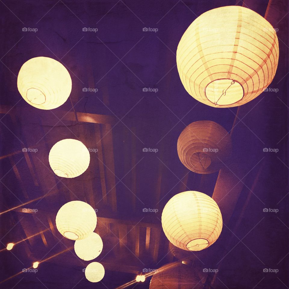 Brightly lit beautiful glowing lanterns lighting up the night sky in the USA, America 