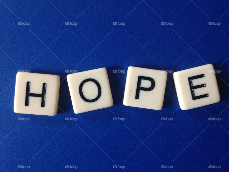 Hope . Word hope made with tile letters