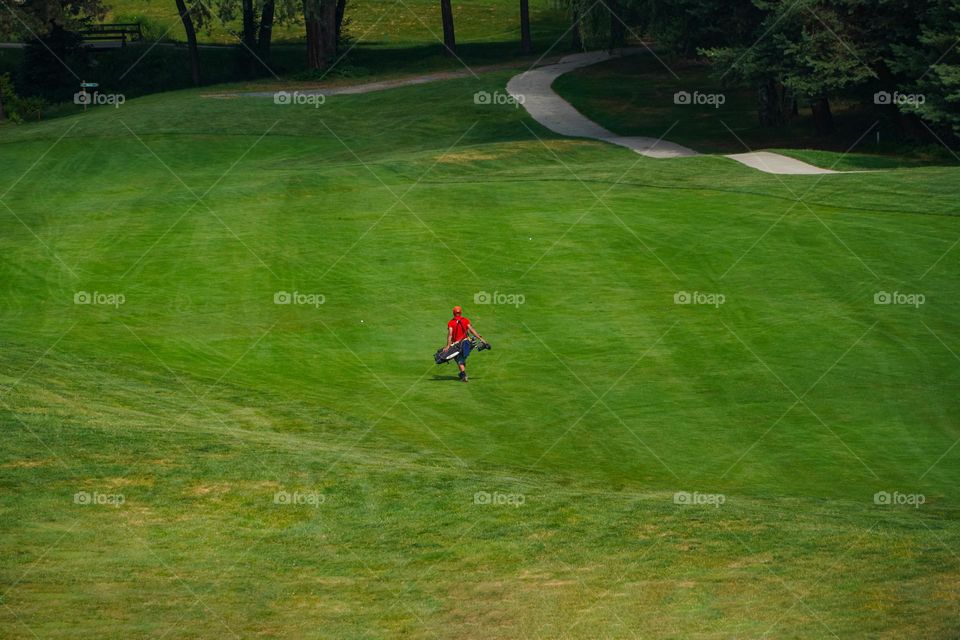 Man in playing golf