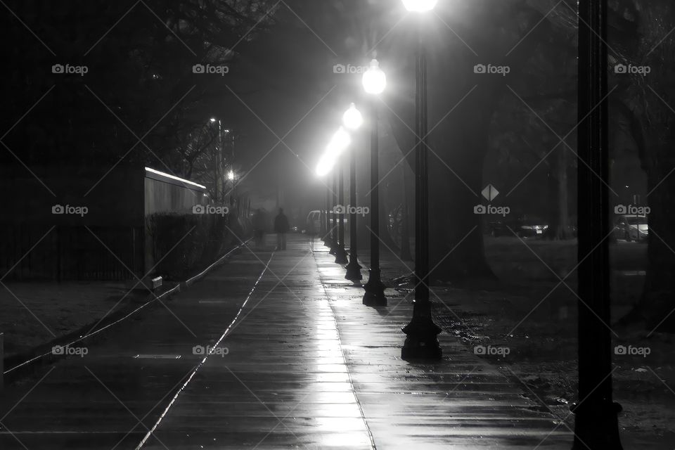 Foggy Sidewalk to Nowhere
An empty sidewalk stretches into the fog, rain, and darkness.