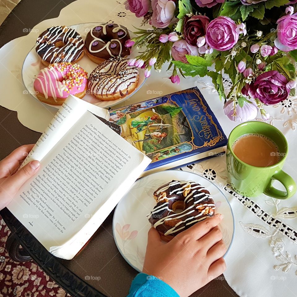 relax reading while eating doughnuts