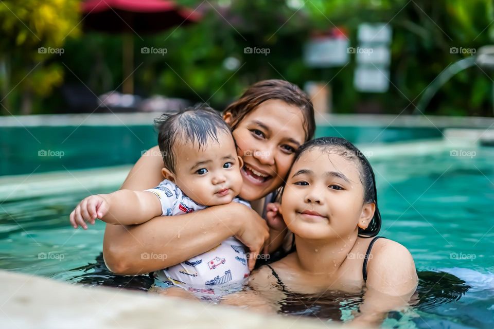 fun in the pool together spending vacation time