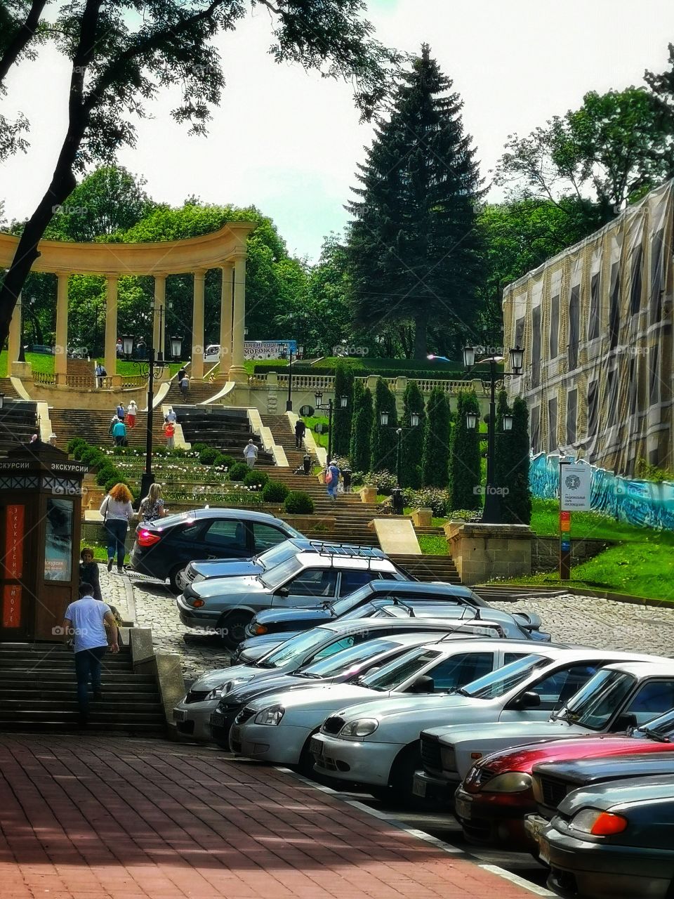 Day outdoor nature greens wild street cars sky clouds moody plant green house Park colors