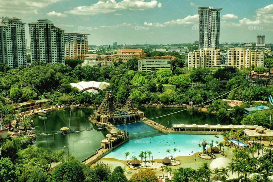The view of the water theme park from above, build in a preserved limestone lake and an old mine, the Sunway Lagoon