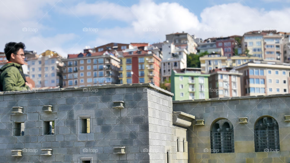 Tourists among miniature historical buildings