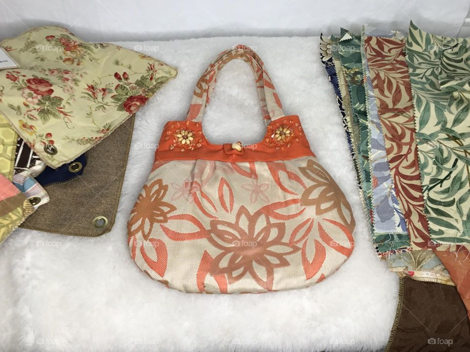 Patchwork Purse is a unique, one of a kind bag, in a gorgeous assortment of prints and solid fabric samples and remnants that create a neutral yet versatile 