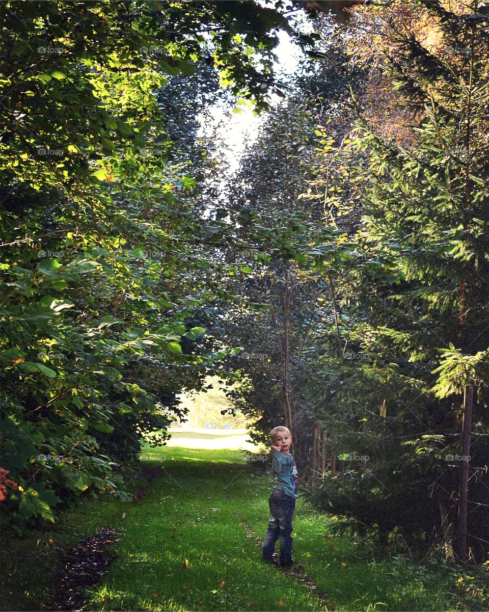 Enjoying the day. Boy out walking in the beautiful autumn weather