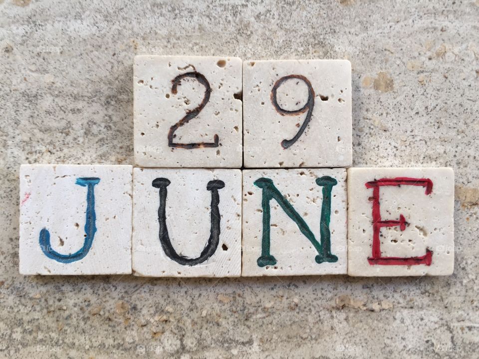 29th June, calendar date. Composition with carved travertine pieces of 29th June, calendar date