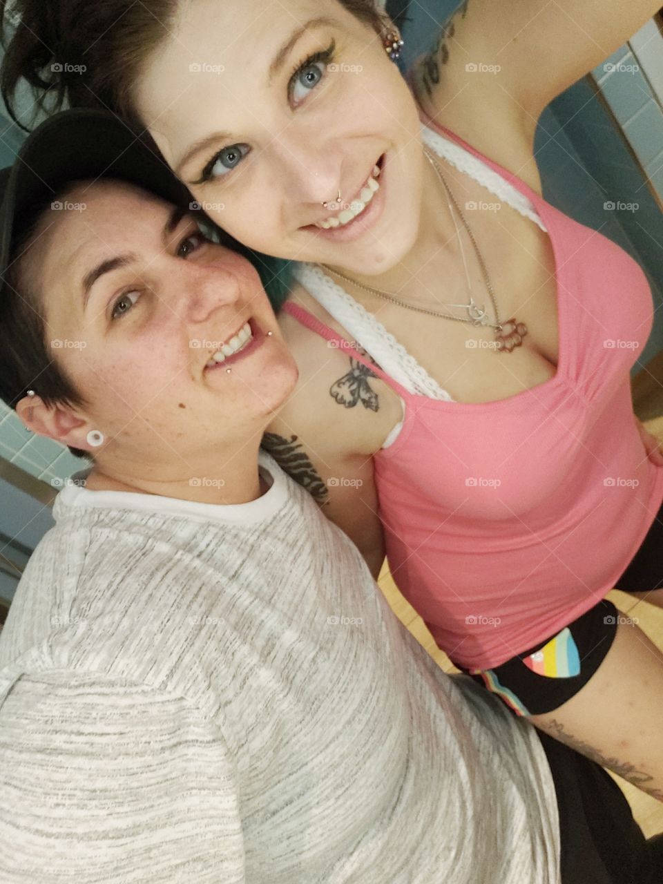 Me (lipstick lesbian in all pink) and my girlfriend Michelle in the public restroom on the cruise ship. I did get jumped for my sexuality the last night. nothing happened.