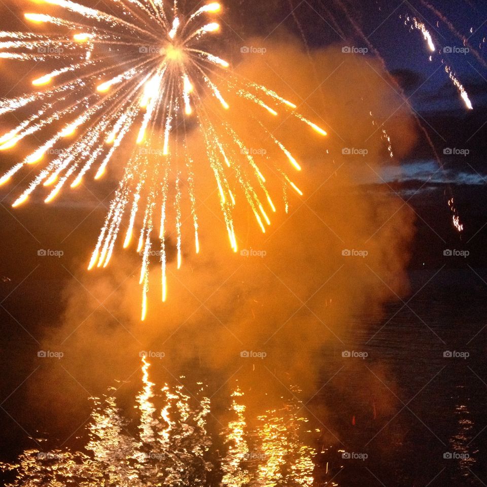 Rocket's Yellow Glare. Fireworks on the water in Washington.