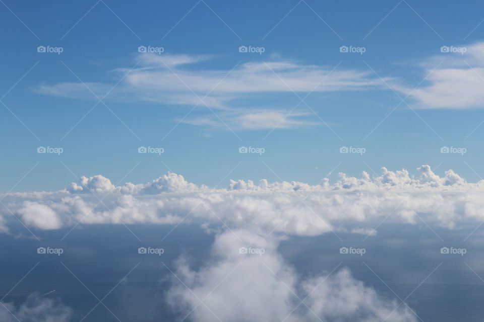 These are white beautiful clouds captured while  approaching Curacao Island.