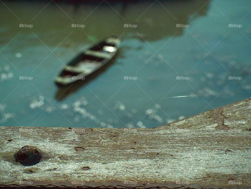 Boat on the lazy river. Old boat on Sava river