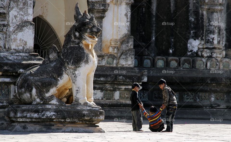 Kids playing in pagoda courtyard