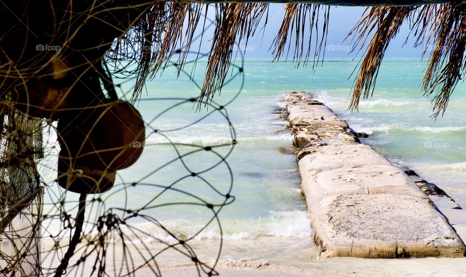 A framed beach scene.