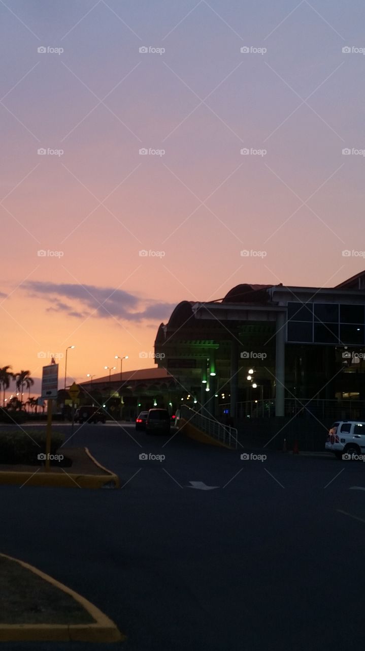 front of airport with an amazing sky