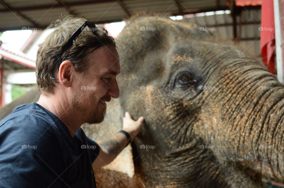 man with elephant bangkok thailand
