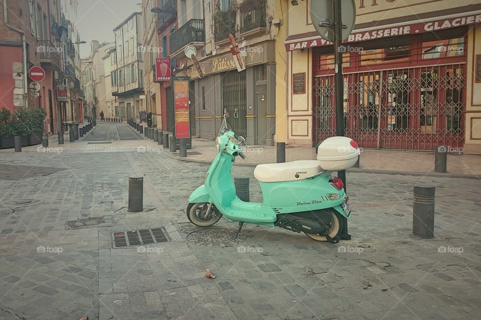 green scooter in the street