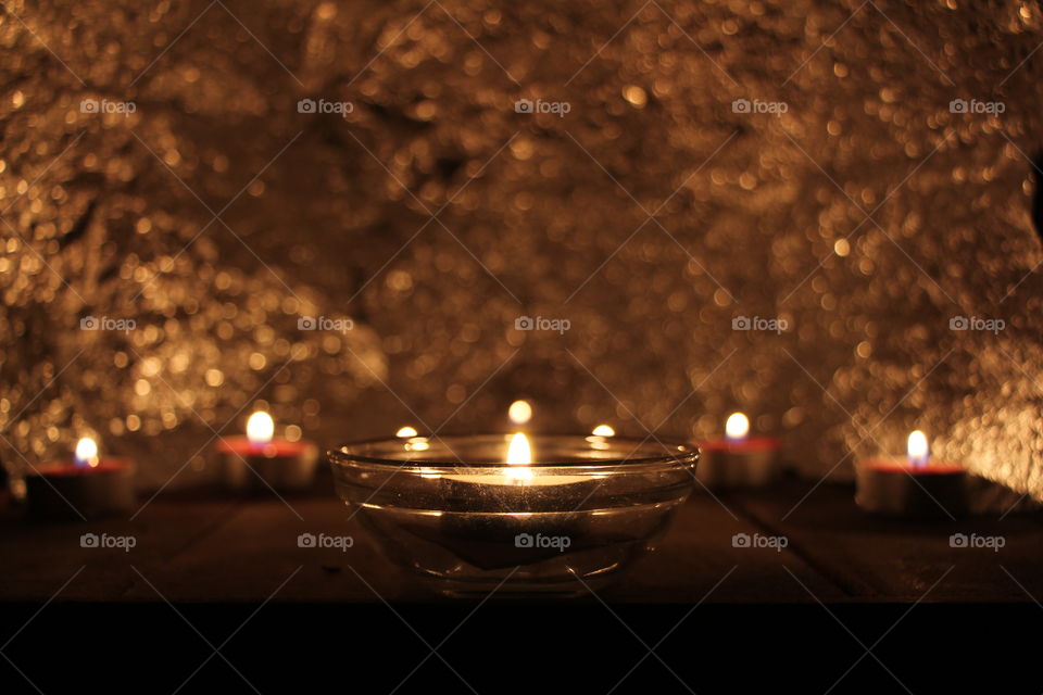 Warm Flame. Practicing color temperature i created this relaxed warm ambient with a composition of candles and also created an interesting background with focus and light rebound 