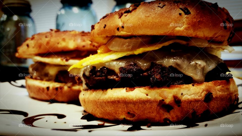 Cheeseburgers topped with egg